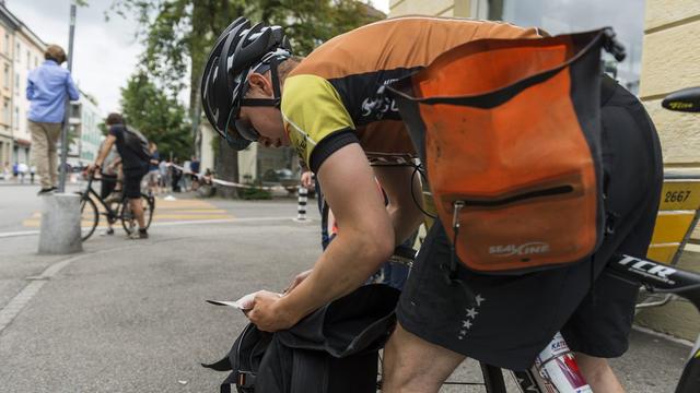 Les coursiers à vélo. [Keystone - Alessandro della Valle]