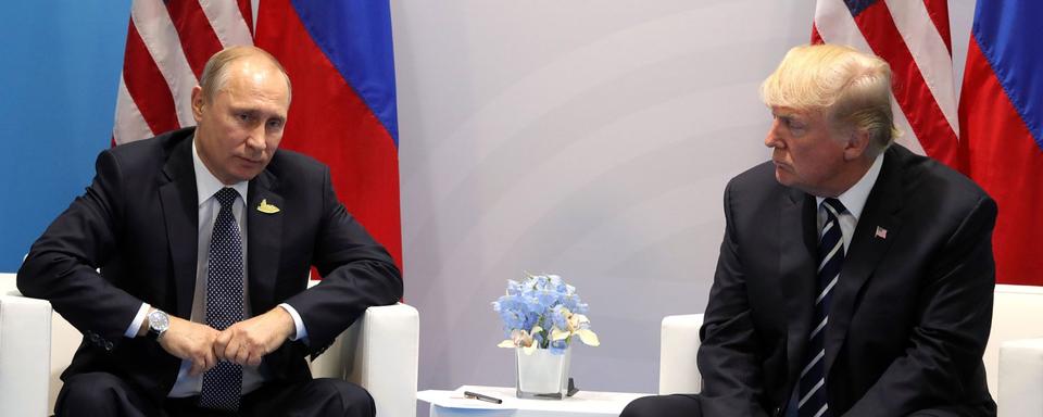 Vladimir Poutine et Donald Trump lors du G20 à Hambourg, 07.07.2017. [Anadoly Agency/AFP - Russian Presidential Press and Information Office]