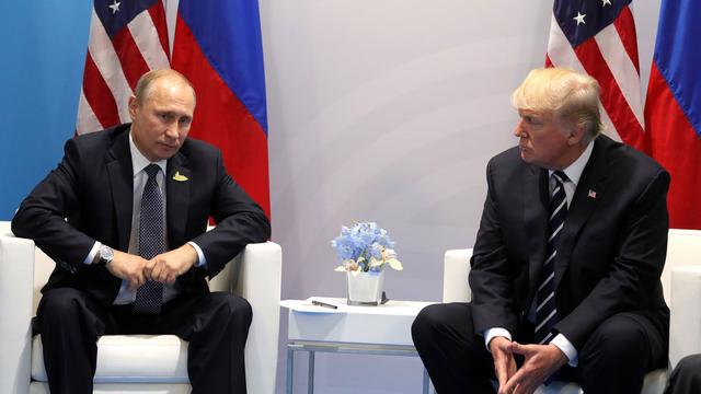 Vladimir Poutine et Donald Trump lors du G20 à Hambourg, 07.07.2017. [Anadoly Agency/AFP - Russian Presidential Press and Information Office]
