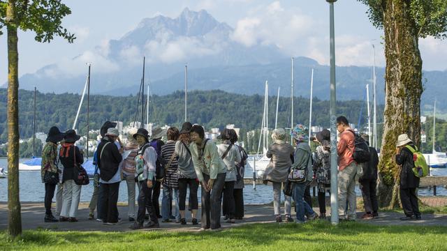 Les touristes asiatiques devraient revenir cet été. [keystone - Sigi Tischler]