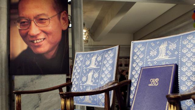 La chaise laissée vide du prix Nobel de la paix Liu Xiaobo, déjà emprisonné à l'époque. [Keystone - Heiko Junge]
