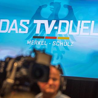 Le débat télévisé entre la chancelière allemande Angela Merkel et le social-démocrate Martin Schulz aura lieu ce dimanche 3 septembre. [Keystone - Michael Kappeler - DPA]