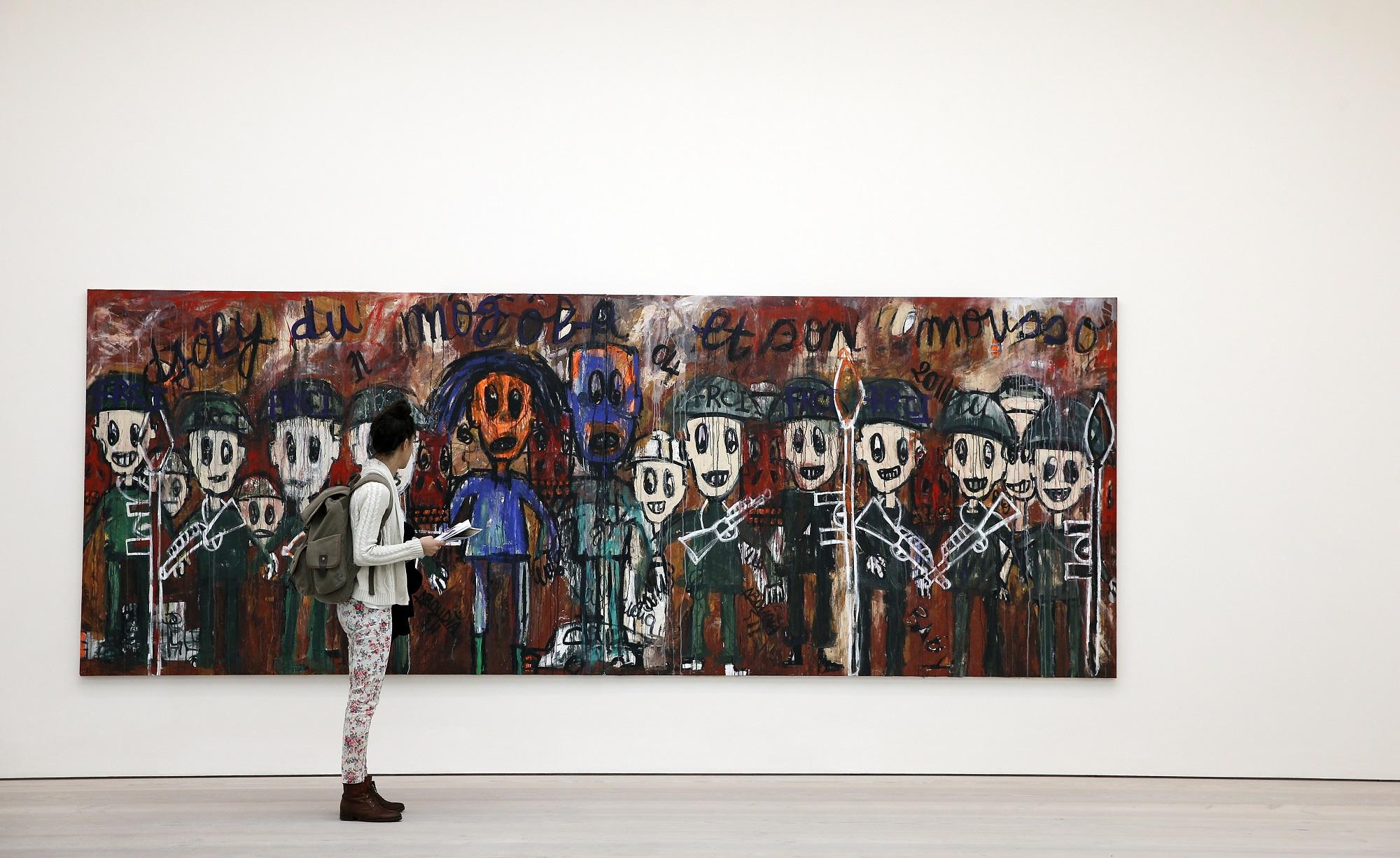 "Djoly du Mogoba", une oeuvre de l'artiste ivoirien Aboudia présentée à la galerie Saatchi de Londres en 2014. [AFP - Adrian Dennis]