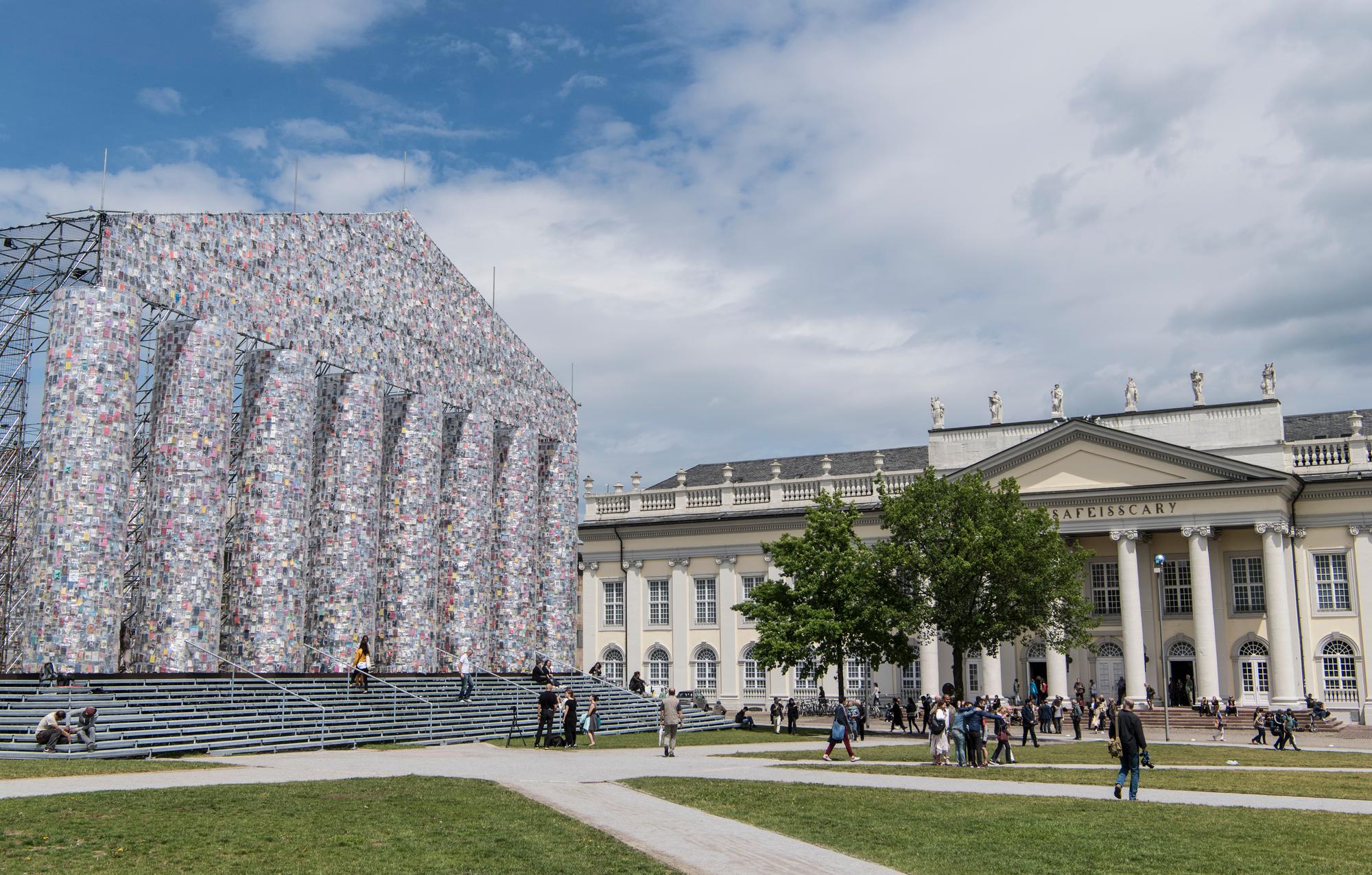 The "Parthenon of books" (l) by Argentinian artist Marta Minujin beside the Fridericianum at the documenta 14 art exhibition in Kassel, Germany, 8 June 2017. The documenta 14 art exhibition officially opens on 10 June 2017. [dpa Picture-Alliance/AFP - BORIS ROESSLER]