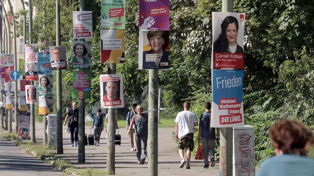 Les affiches ont envahi les rues en Allemagne. [Keystone / DPA]