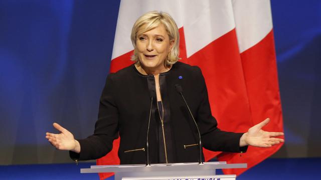 Durant ses "assises présidentielles", Marine Le Pen a dévoilé son projet sous la forme de 144 engagements. [Keystone - Michel Euler]