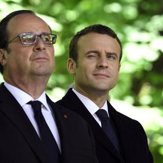 François Hollande et Emmanuel Macron: d'une présidence à l'autre. [Pool/AFP - Eric Fefferberg]