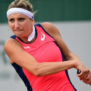 epa06001829 Timea Bacsinszky of Switzerland in action against Madison Brengle of the USA during their women’s single 2nd round match during the French Open tennis tournament at Roland Garros in Paris, France, 31 May 2017. [EPA - YOAN VALAT]