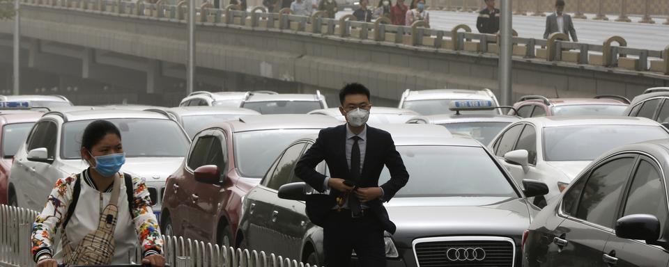 La ville de Pékin lutte de manière chronique contre la pollution atmosphérique et les embouteillages. [Andy Wong]