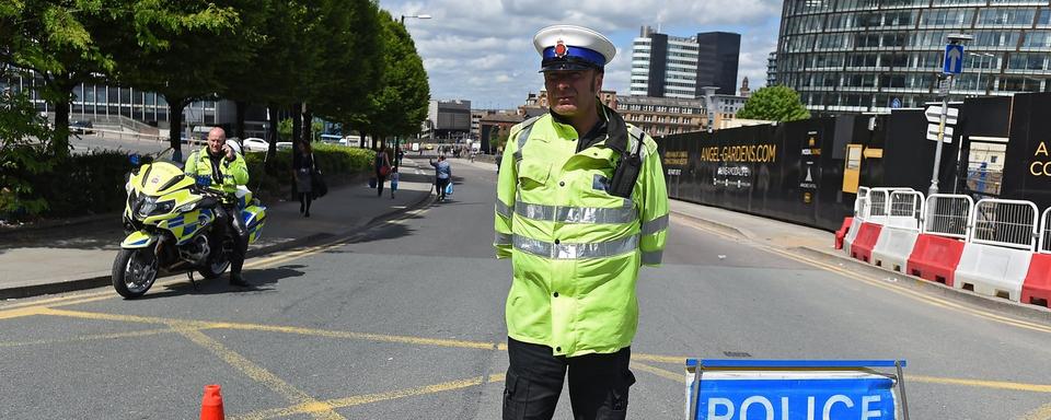 Les environs de la Manchester Arena ont été bloqués par la police. [keystone - EPA/Andy Rain]