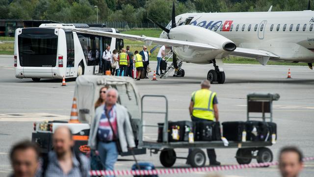 Un appareil d'Adria Airways sur le tarmac de Lugano en septembre 2017. [Ti-Press/Keystone - Gabriele Putzu]