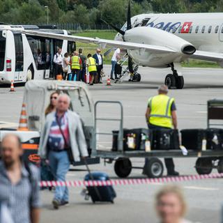 Un appareil d'Adria Airways sur le tarmac de Lugano en septembre 2017. [Ti-Press/Keystone - Gabriele Putzu]