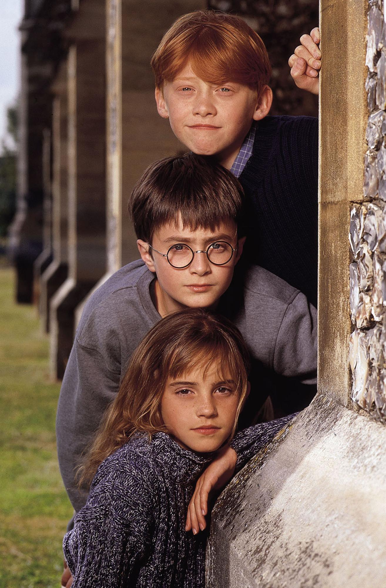 Les trois principaux acteurs du film "Harry Potter à l'école des sorciers": Rupert Grint, Daniel Radcliffe et Emma Watson (de haut en bas). [Reuters/Warner Brothers - Terry O'Neill]