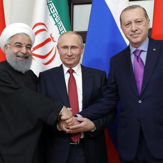 Le président russe Vladimir Poutine reçoit Hassan Rohani et Recep Tayyip Erdogan à Sotchi, le 22 novembre 2017. [SPUTNIK / AFP - Mikhail METZEL]