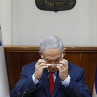 Le Premier ministre israélien Benjamin Netanyahou doit faire face à deux enquêtes pour corruption. [Keystone - Gali Tibbon]