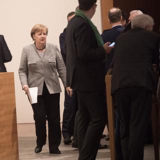 Ultime tentative d'Angela Merkel de former un gouvernement. [Keystone - Jörg Carstensen]