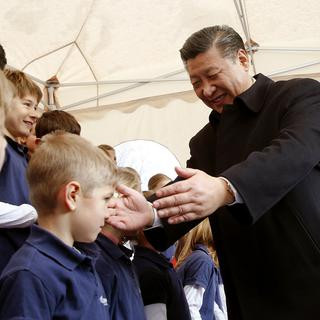 La visite du président chinois en Suisse trouve un écho positif dans la presse chinoise. [keystone - Arnd Wiegmann/Pool Photo via AP]