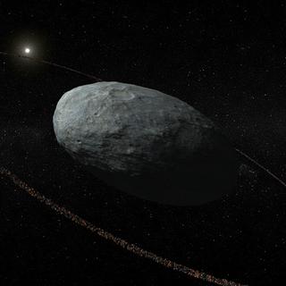 Image de la planète naine Haumea et de son anneau.
Handout/NATURE PUBLISHING GROUP
AFP [Handout/NATURE PUBLISHING GROUP]