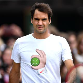 Roger Federer pendant une session d'entraînement à Wimbledon. [AFP - Leon Neal]