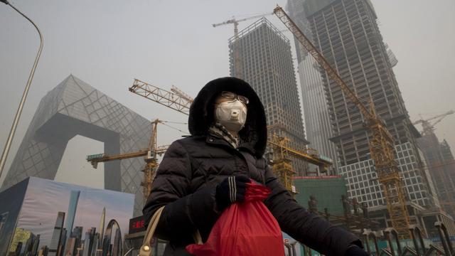 Pékin souffre de la pollution. [keystone - AP Photo/Ng Han Guan]