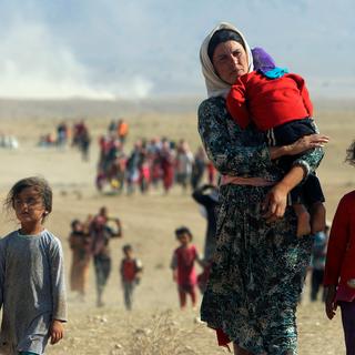 Les images des Yézidis fuyant l'avancée du groupe EI avaient précipité l'intervention internationale contre les djihadistes. [Reuters - Rodi Said]