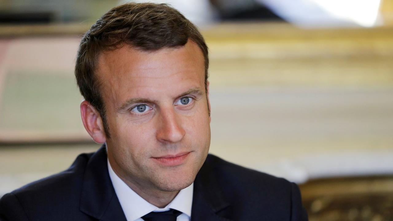 Pas si facile de caricaturer le nouveau président français Emmanuel Macron. [EPA/Keystone - Philippe Wojazer]