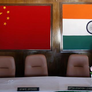 A man walks inside a conference room used for meetings between military commanders of China and India, at the Indian side of the Indo-China border at Bumla, in the northeastern Indian state of Arunachal Pradesh, November 11, 2009. With ties between the two Asian giants strained by a flare-up over their disputed boundary, India is fortifying parts of its northeast, building new roads and bridges, deploying tens of thousands more soldiers and boosting air defences. Picture taken November 11, 2009. [Reuters - Adnan Abidi]