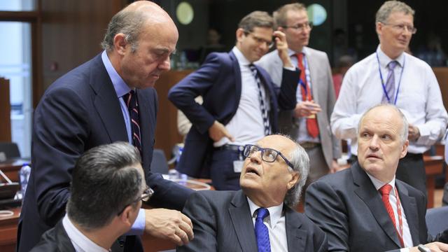 Les ministres de l'Economie de plusieurs pays de l'Union européenne réunis le 23 mai à Bruxelles. [Keystone - Olivier Hoslet]