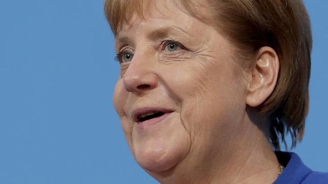 Angela Merkel a qualifié de "bon" le compromis sur les migrants. [Keystone - AP Photo/Michael Sohn]