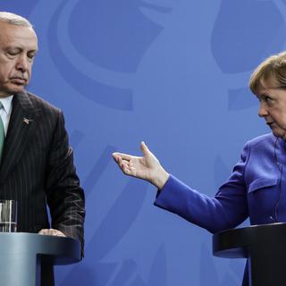 La chancelière allemande Angela Merkel et le président turc Recep Tayyip Erdogan, le 28 septembre 2018 à Berlin. [Keystone - Michael Kappeler]