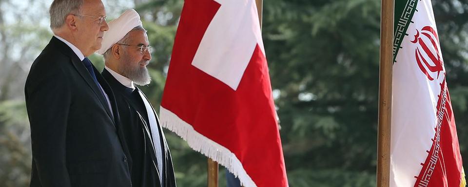 Johann Schneider-Ammann se rendait à Téhéran en 2016, avant l'entrée en vigueur un an plus tard d'un accord commercial entre les deux pays. [EPA/Iranian presidential office/Keystone]