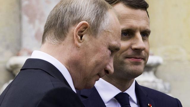 Vladimir Poutine et Emmanuel Macron (ici, à Versailles en mai 2017). [Pool/Reuters - Etienne Laurent]