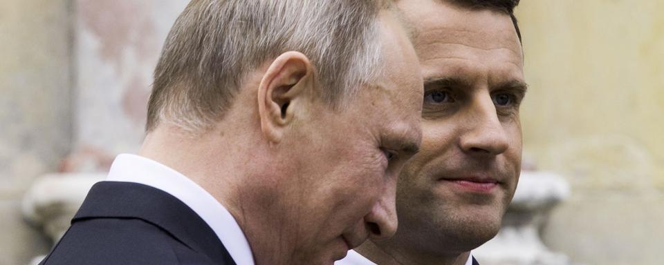 Vladimir Poutine et Emmanuel Macron (ici, à Versailles en mai 2017). [Pool/Reuters - Etienne Laurent]