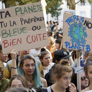 Plusieurs milliers de personnes avaient défilé mi-octobre dans les rues de Genève lors de la Marche pour le climat. [Keystone - Salvatore Di Nolfi]