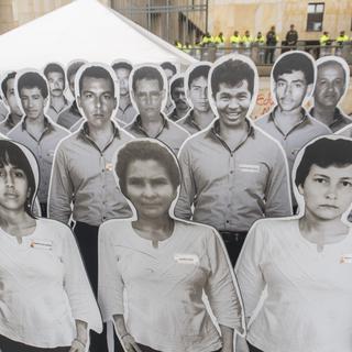 Hommage en photos à des personnes disparues pendant la guerre en Colombie. [AFP - Daniel Garzon Herazo]