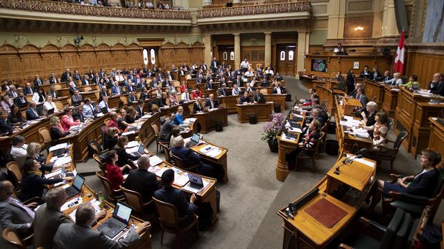 Le Conseil national a affaibli la loi sur l'égalité salariale. [Keystone - Anthony Anex]