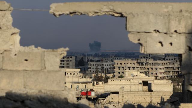 Une explosion sur la Ghouta, capturée depuis le centre de Damas. [Keystone - Diaa Al Din]