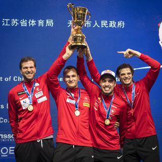 Lucas Malcotti (deuxième à partir de la gauche) et ses coéquipiers ont décroché le titre mondial à Wuxi, en Chine, le jeudi 26 juillet 2018. [Keystone - Aleksandar Plavevski - EPA]