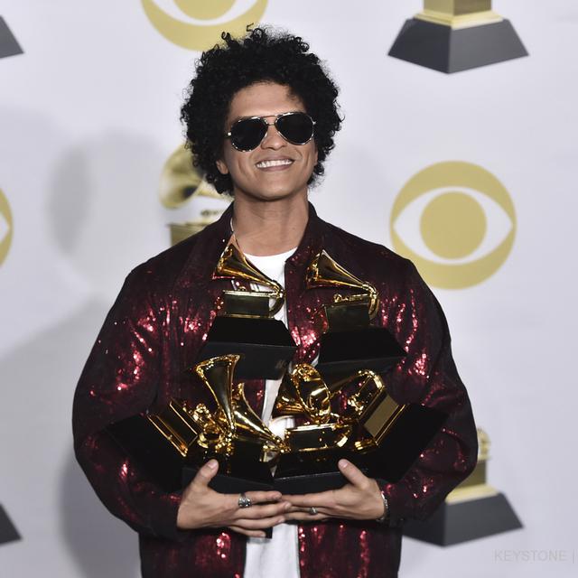 Bruno Mars raffle les récompenses aux 60e Grammy Awards en 2018. [Keystone - Charles Sykes]