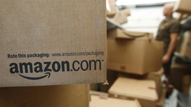 Le partenariat en discussion entre Amazon et La Poste suscite l'inquiétude des acteurs privés en Suisse. [AP/Keystone - Paul Sakuma]