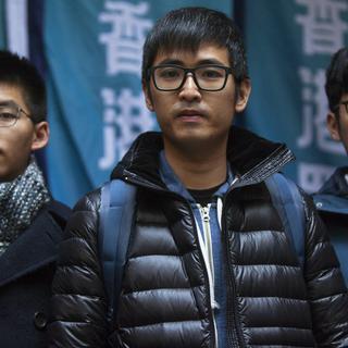 Trois membres du mouvement démocratique "des parapluies" libérés à Hong Kong. [keystone - EPA/Alex Hofford]