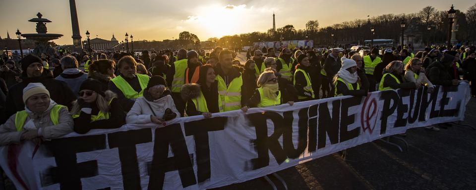 Qui sont les "gilets jaunes" qui paralysent la France? [EPA/Keystone - Ian Langsdon]