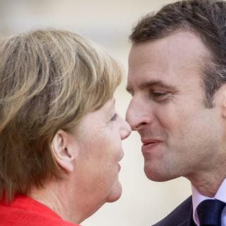 Angela Merkel et Emmanuel Macron (ici, le 19.04.2018 à Berlin). [DPA/Keystone - Michael Kappeler]