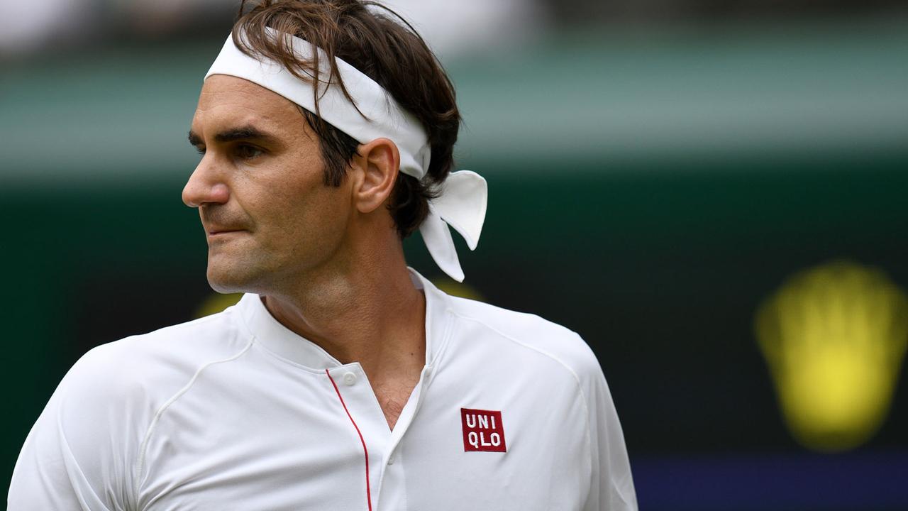 Federer arbore la tenue de son nouveau sponsor depuis le début du tournoi de Wimbledon. [AFP - Oli Scarff]