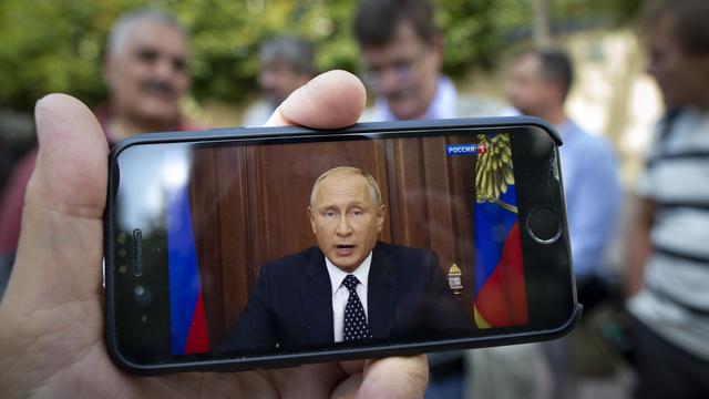 Le président russe Vladimir Poutine s'est exprimé lors d'une rare adresse télévisée à la nation. [Keystone/AP Photo - Alexander Zemlianichenko]