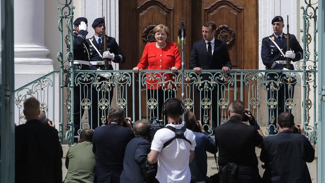 Angela Merkel et Emmanuel Macron à Berlin mardi. [AP/Keystone - Markus Schreiber]