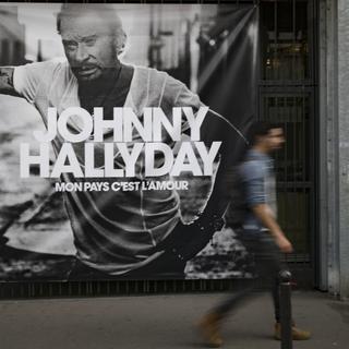 Une affiche promotionnelle pour "Mon pays c'est l'amour", le dernier album studio de Johnny Hallyday. [AFP - Geoffroy Van Der Hasselt]