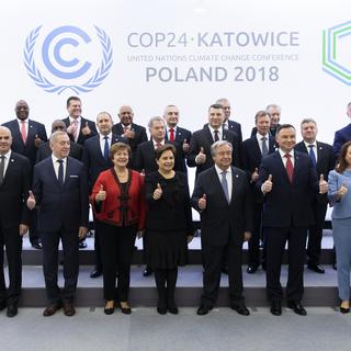 COP24 à Katowice en Pologne, 3 décembre 2018. Alain Berset, président de la Confédération, au 1er rang entre les présidents de Slovénie et du Monténégro. [Keystone - Peter Klaunzer]