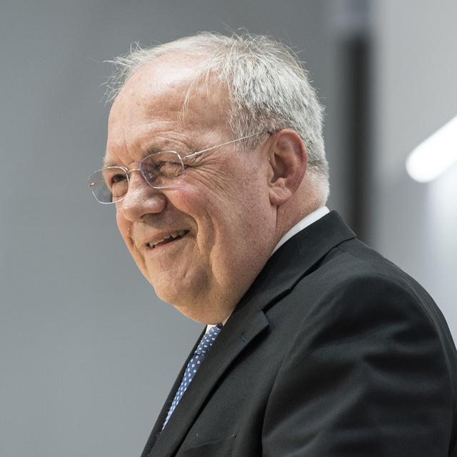 Johann Schneider-Ammann souriant après l'annonce de sa démission. [Keystone - Peter Schneider]