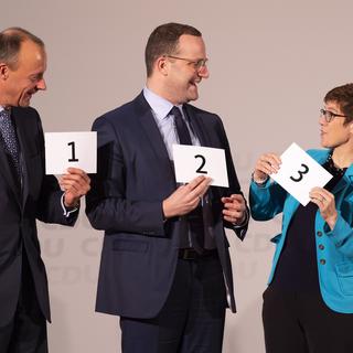 Trois candidats sont en lice pour succéder à Angela Merkel à la tête de la CDU. [AP/Keystone - Jens Meyer]